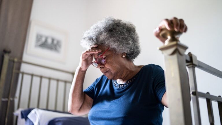 woman thinking on her bed related to memory disorder