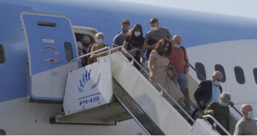 passengers getting off a plane stairs