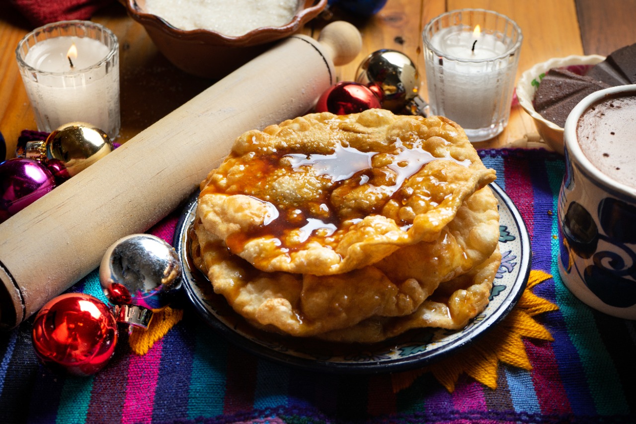 Mexican buñuelo with kitchen utensils