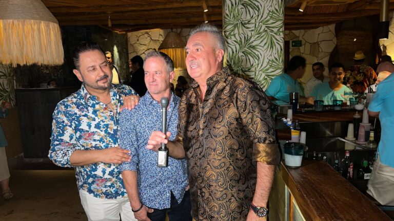 three men talking in front of the camera in Daiquri Dick's reopening