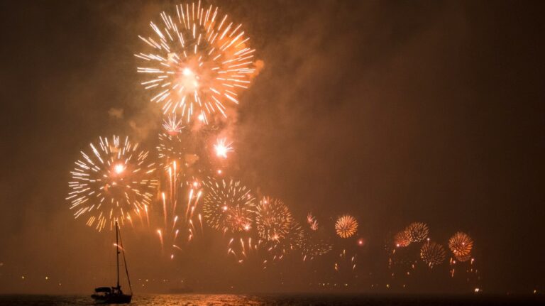 Fireworks over a boat and sea in Cabo