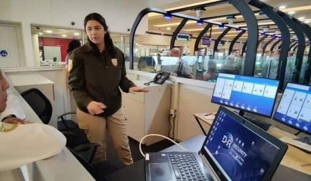 Immigration officer at electronic gates in Cancun airport