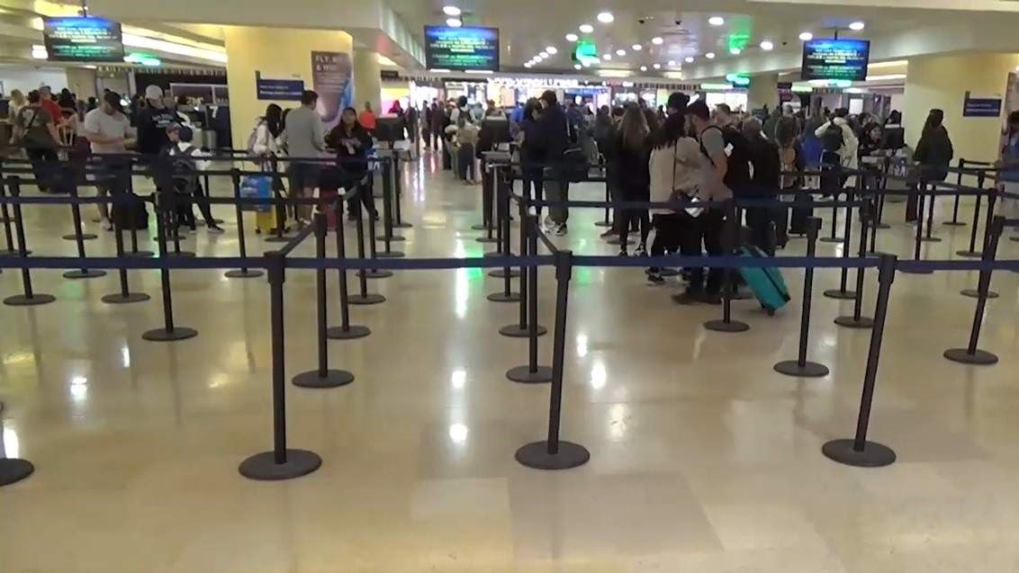 Passengers lining inside Cancun airport