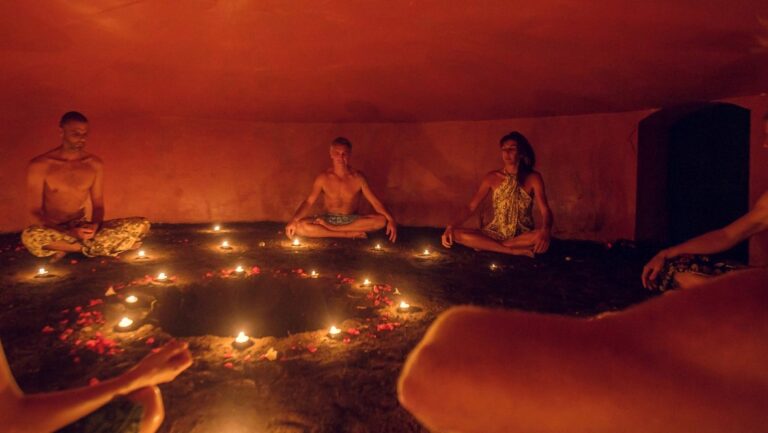 people sitting insidea Mayan temazcal