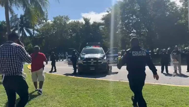 Police freeing the street in Cancun taxi blockade