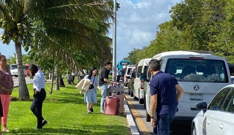 cars and tourists stranded in Cancun taxi blockade against Uber