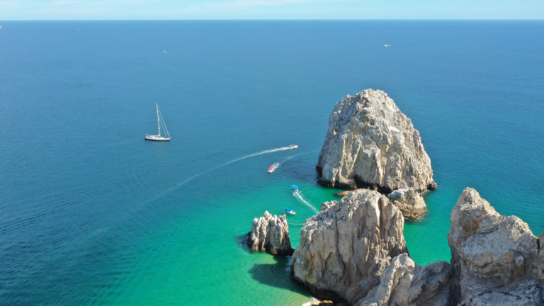 Aerial view of Los Cabos rock formation with green and blue sea