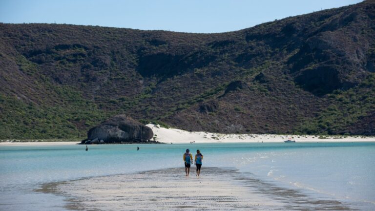 Couple walking on Playa Balandra