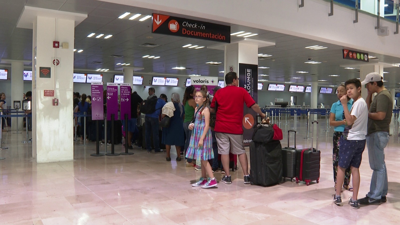 passemgers lining up at Puerto Vallarta International Airport