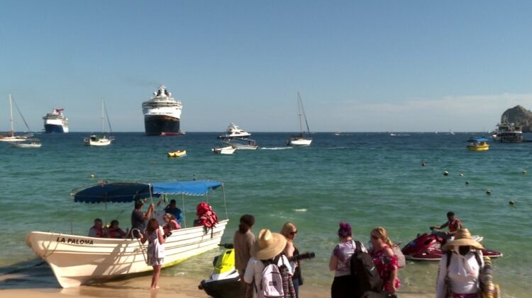 tourists and boats at El Medano beach