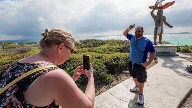 tourists taking photographs in Isla Mujeres