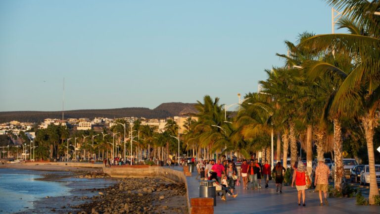 Visitors to La Paz’s public Malecon stroll along the ocean boardwalk.