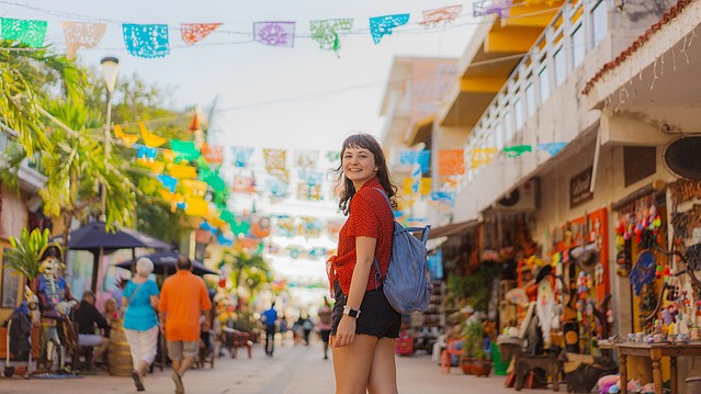 Young girl standing on a Playa del Carmen street