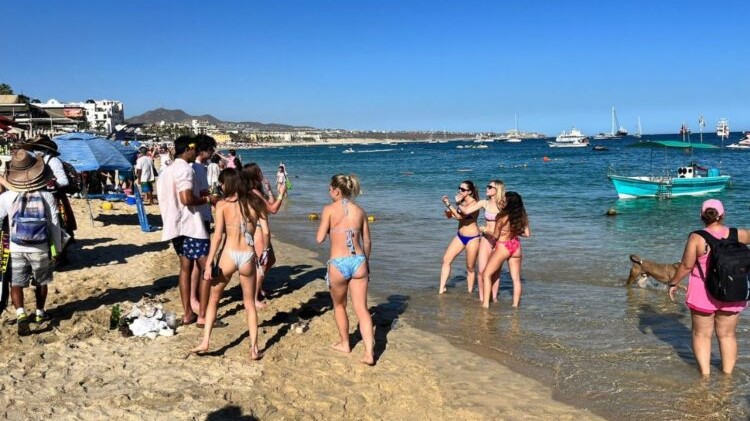 Tourists on Los Cabos beach