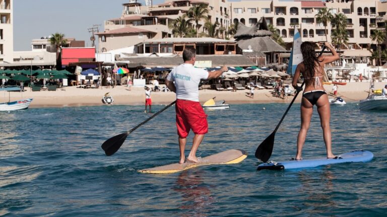 couple paddelboarding off Los Cabos shore