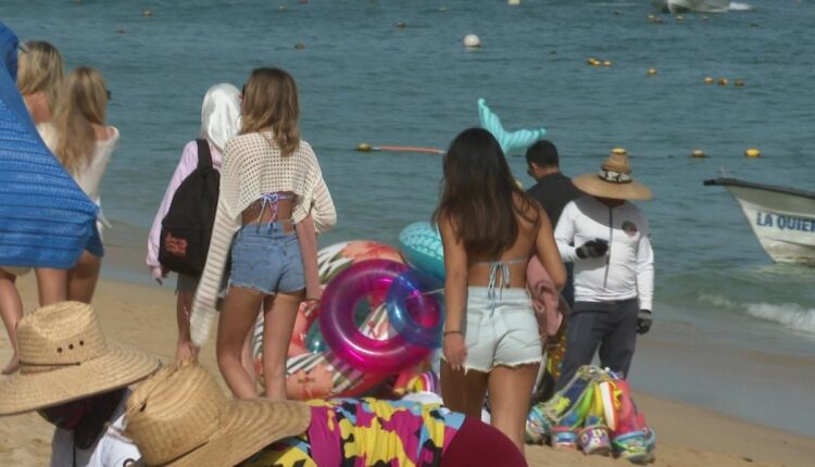 Tourists on Los Cabos beach