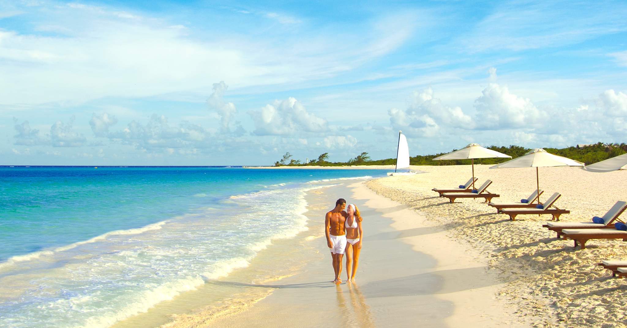 Couple walking on Maroma Beach