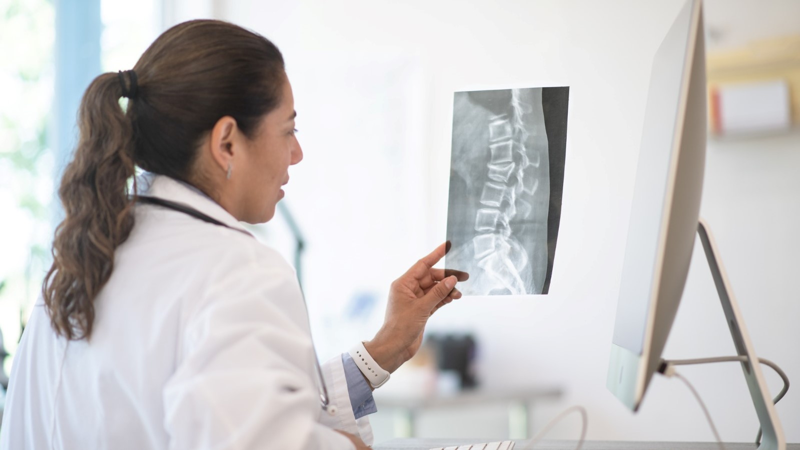 Doctor watching a spine xray