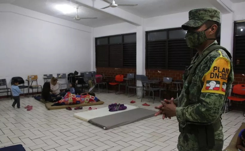 A soldier watching a shelter in Cancun