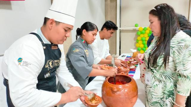 Chef serving a patron Mexican food