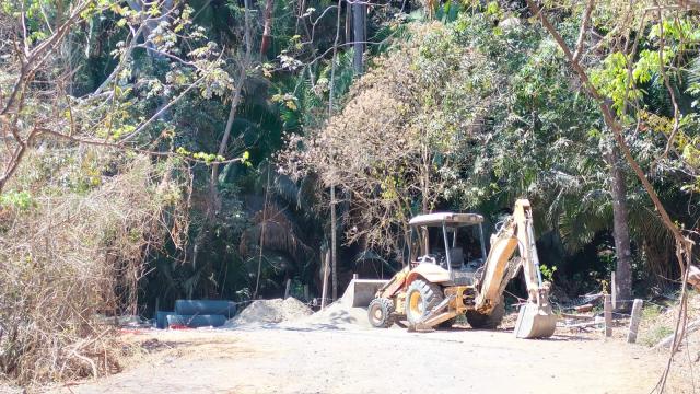 Machinery standing idle in an Amapas construction site.