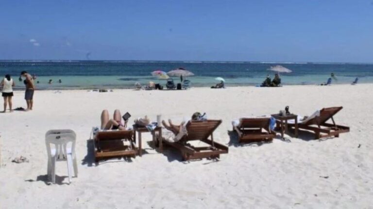 tourists on the beach of Puerto Morelos