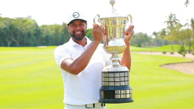 Tony Finau holding his trophy as cahmpion of the Mexico Open at Vidanta