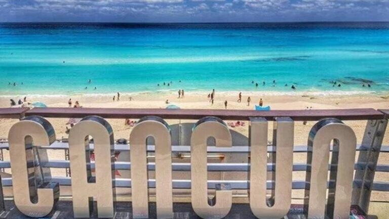 Cancun sign on the beach