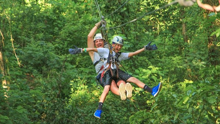 Couple of maen ziplining in Puerto Vallarta jungle