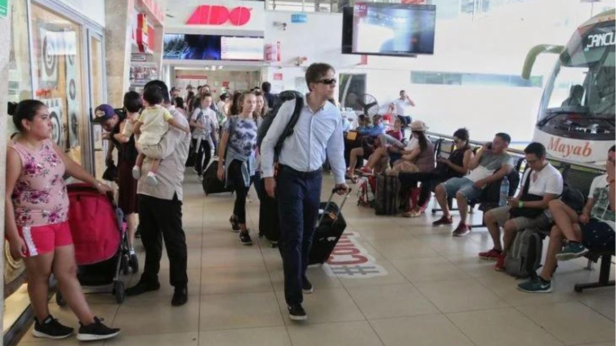 Passengers walking to take the bus at ADO terminal in Cancun