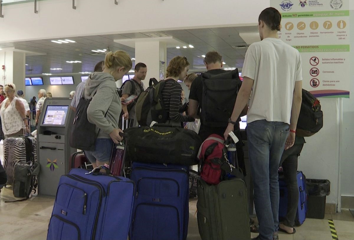 passengers lining up in Puerto Vallarta airport