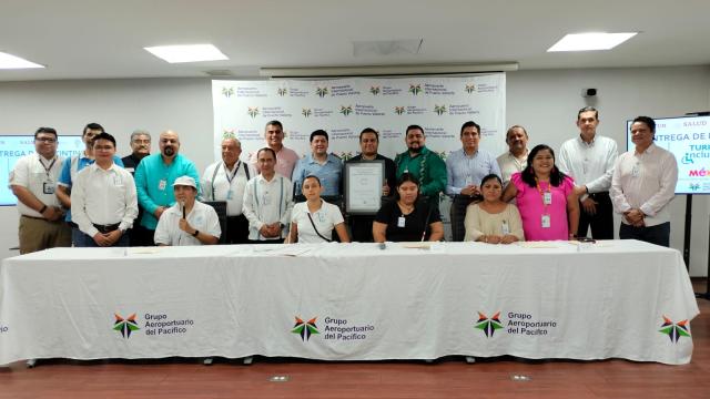 Puerto Vallarta airport officials receiving Inclusive Tourism badge