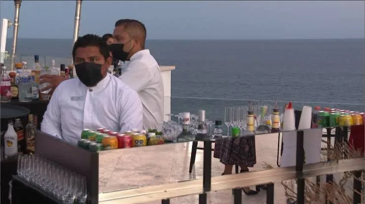 Bartender working in a hotel by the sea