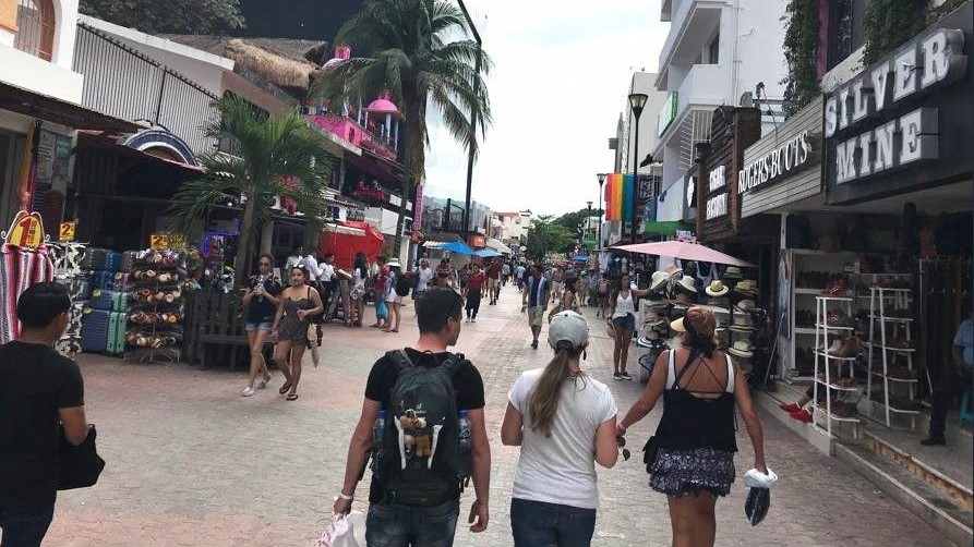 Tourists walking on Fifth Avenue in Playa del Carmen