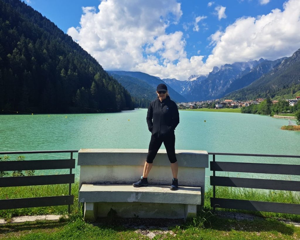 Woman standing on a bench at Lake Misurina