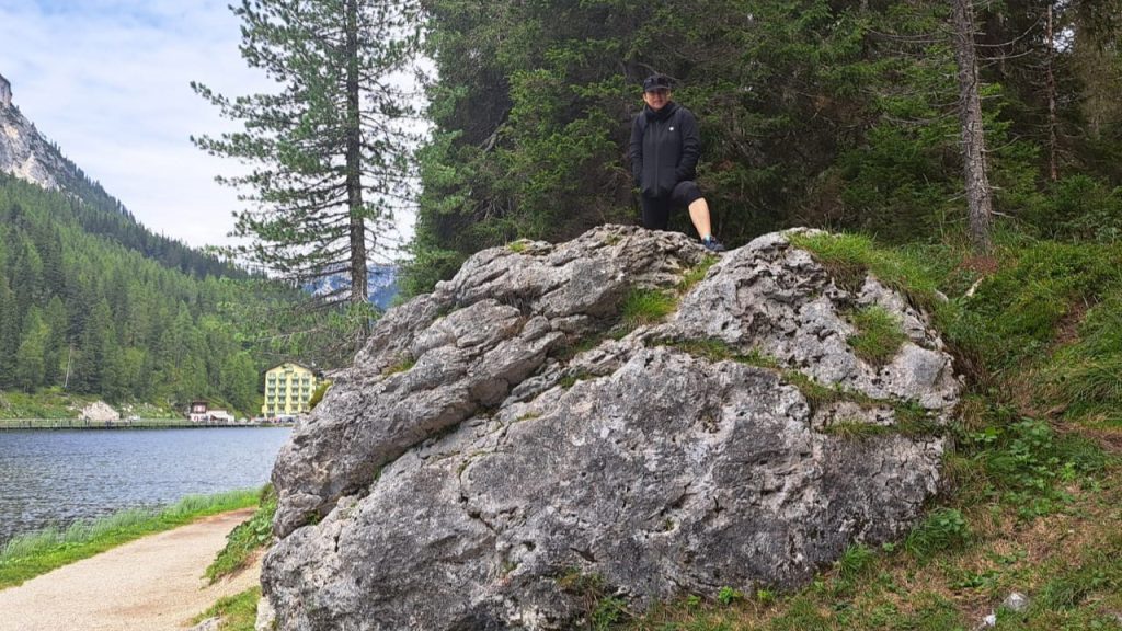 Woman on a rock by Misurina Lake