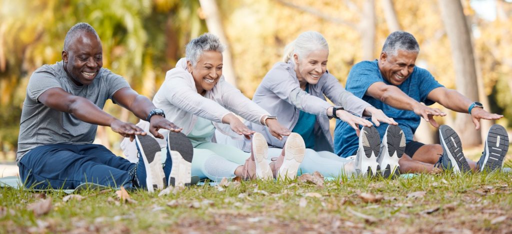 Older people stretching in the country