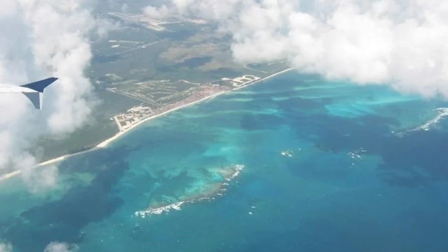 view of Cancun from an airplane window of new Calgary-Cancun flight