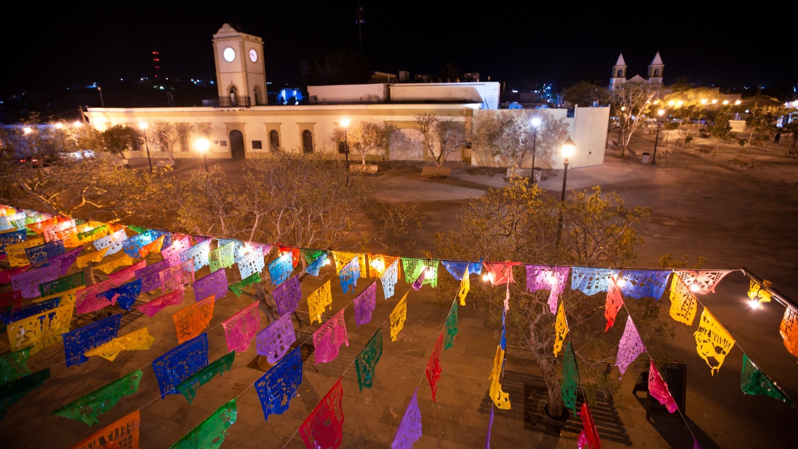 A vibrant array of flags adorns the plaza, showcasing a diverse and colorful display