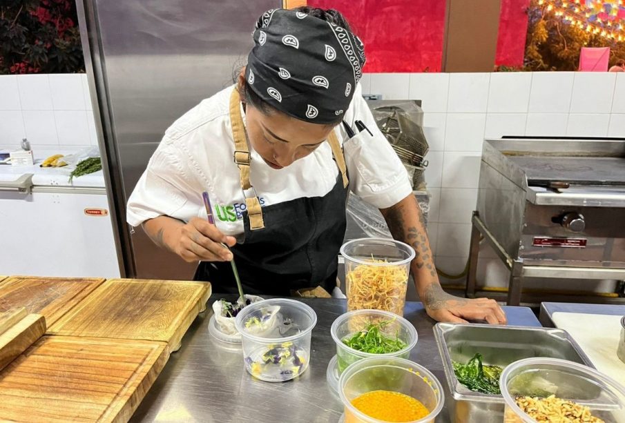 chef preparing food at work station