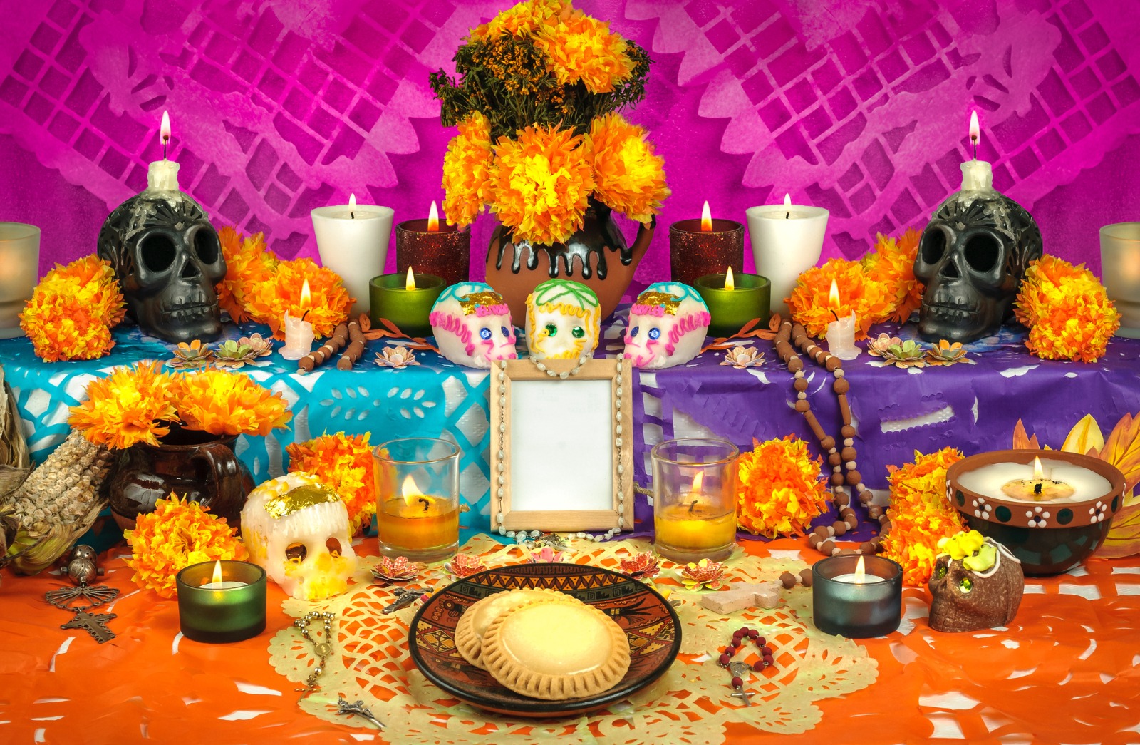 Day of the Dead altar with papel picado and marigold