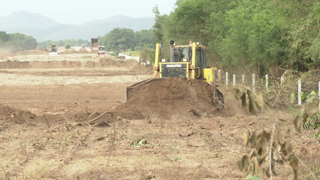 Machinery dragging earth