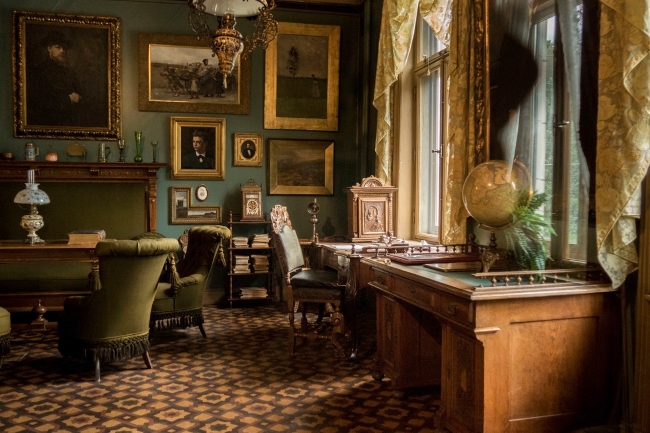 Green and gold decor in Henrik Ibsen's office in the Ibsen Museum