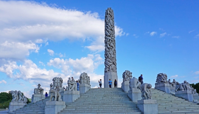 Steps leading to Monolith set against bright blue sky in Vigeland Sculpture Park