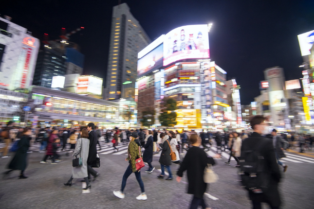 Busy Shibuya city at night with people crossing the street