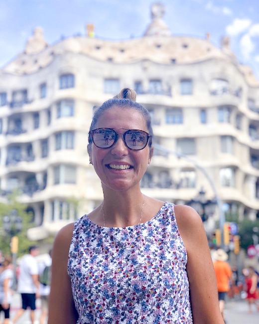 Juliana in sunglasses in front of Gaudi's La Pedrera in Barcelona