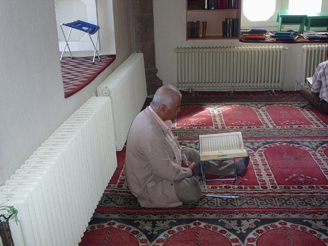 a man reading Quran