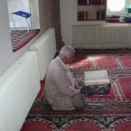 a man reading Quran
