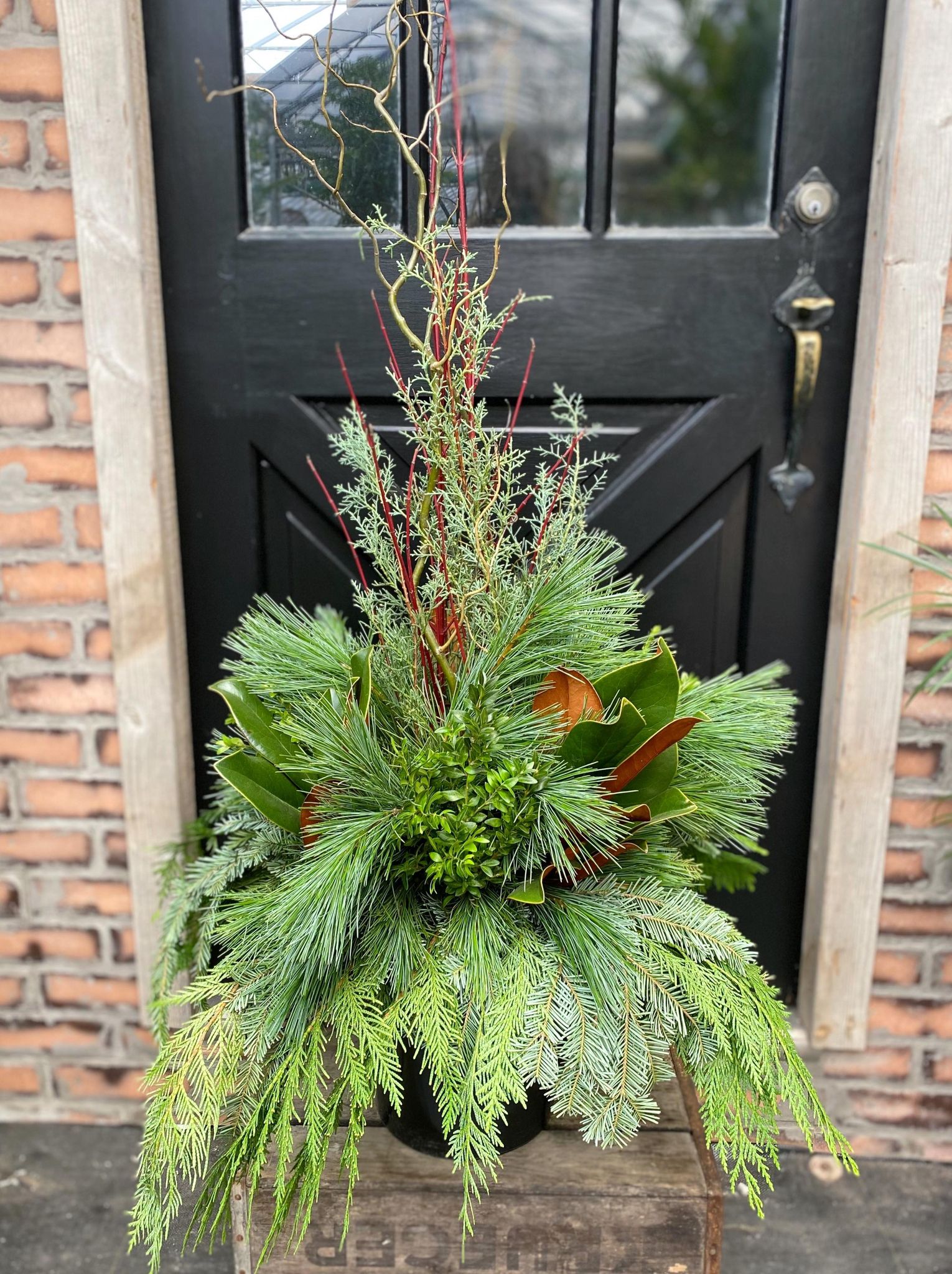 This kit features branches and seasonal greens but no decorations.