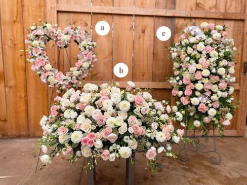 A matching pink and white heart, an easel spray, a casket spray bereavement design.